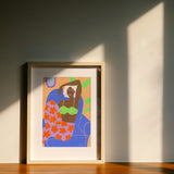Girl on orange flowers Art Print | Julieta Fama x decollective